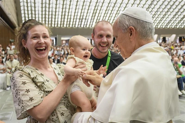 Pope Leo meets a family at the general audience on Aug. 27, 2025. Credit: Vatican Media