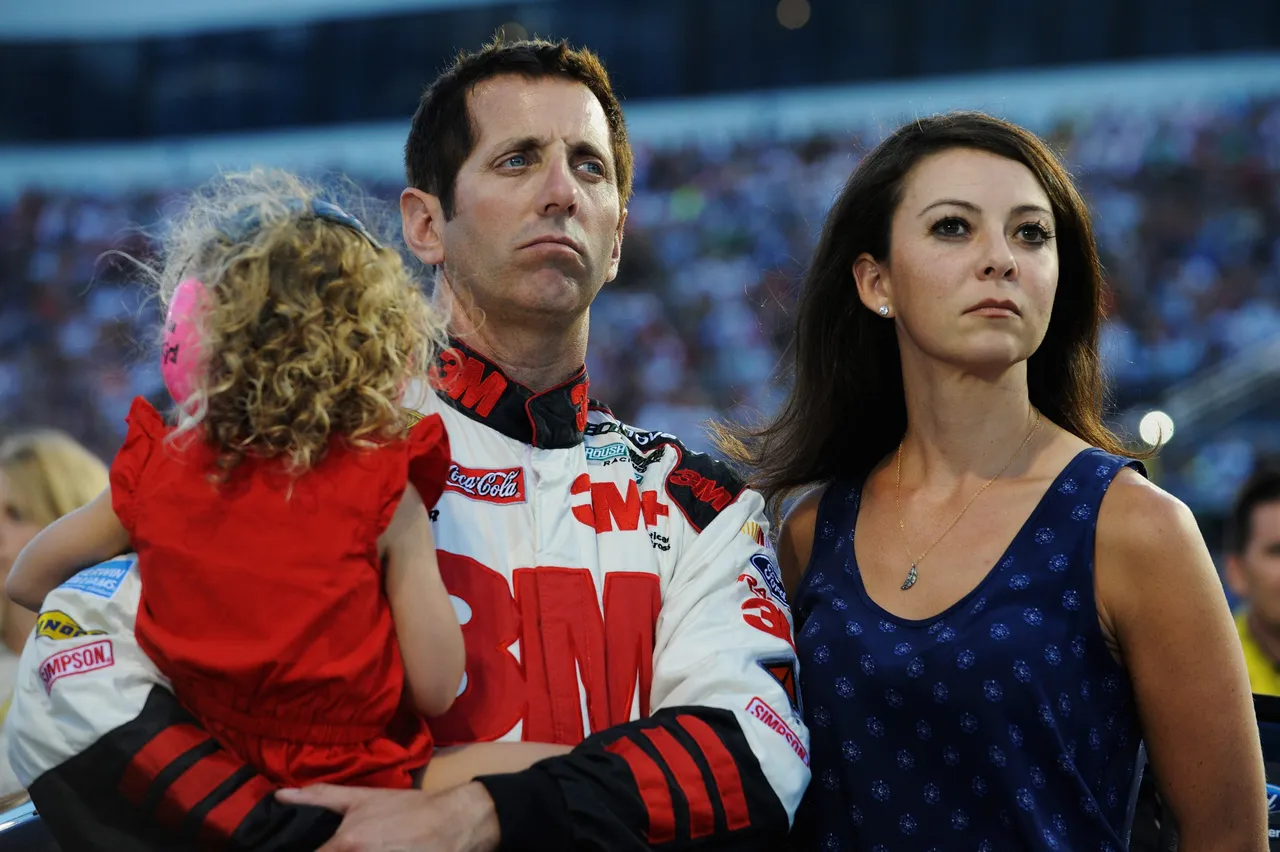 RICHMOND, VA - SEPTEMBER 06: Greg Biffle, driver of the #16 3M Call Before You Dig Ford, takes part in pre-race ceremonies with wife Nicole and daughter Emmafor the NASCAR Sprint Cup Series Federated Auto Parts 400 at Richmond International Raceway on September 6, 2014 in Richmond, Virginia. (Photo by Rainier Ehrhardt/Getty Images)