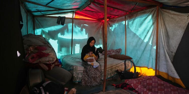 Chilly Gaza braces for more winter rain and word of any progress in ceasefire talks