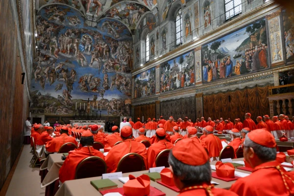 Cardinals prepare to begin the conclave to elect a new pope in the Sistine Chapel on May 7, 2025. Credit: Vatican Media
