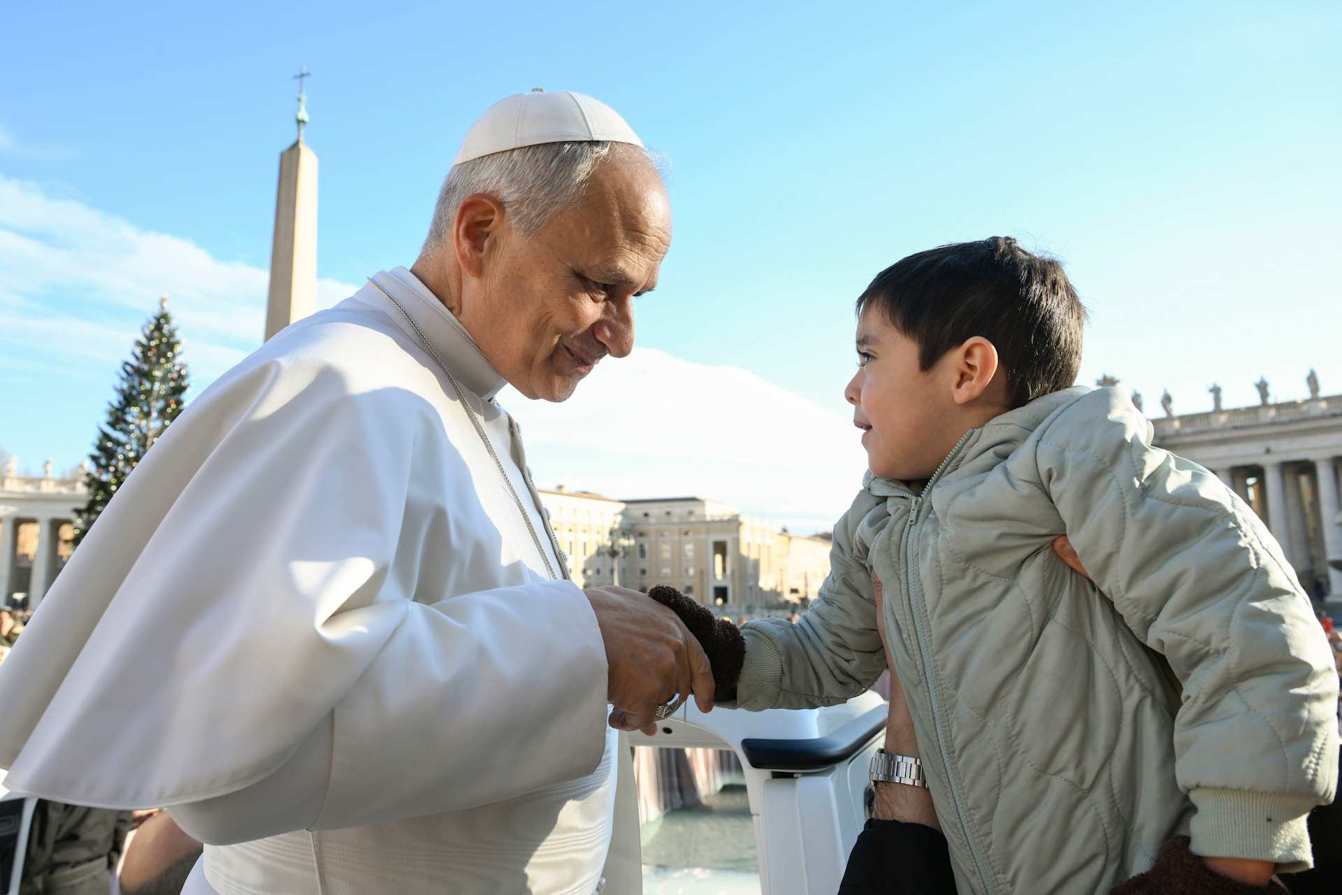 Pope Leo XIV greets a young pilgrim during his Wednesday general audience on Dec. 31, 2025, in St. Peter’s Square at the Vatican. | Credit: Vatican Media
