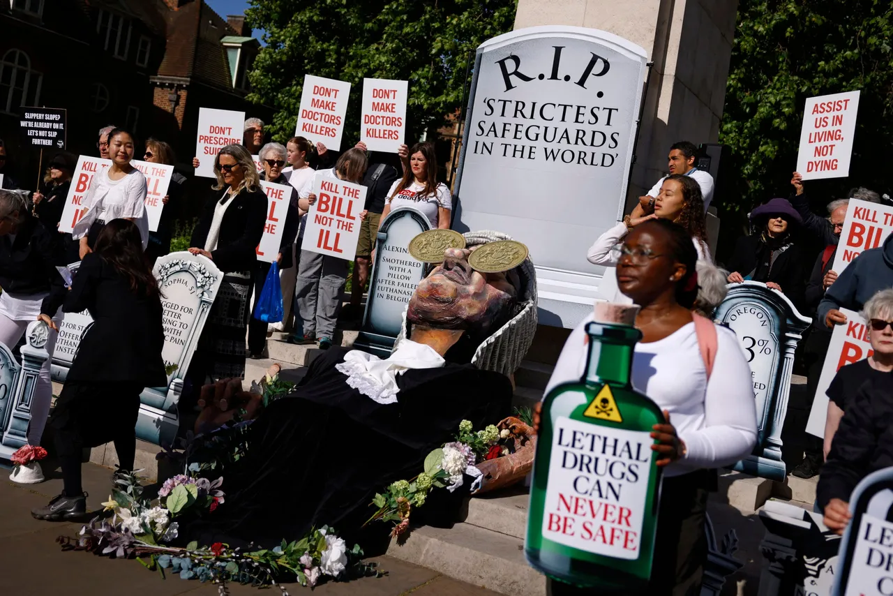 Protesters against the assisted dying bill gather for a counter-protest with placards near to The Palace of Westminster, home to the Houses of Parliament in central London, on May 16, 2025