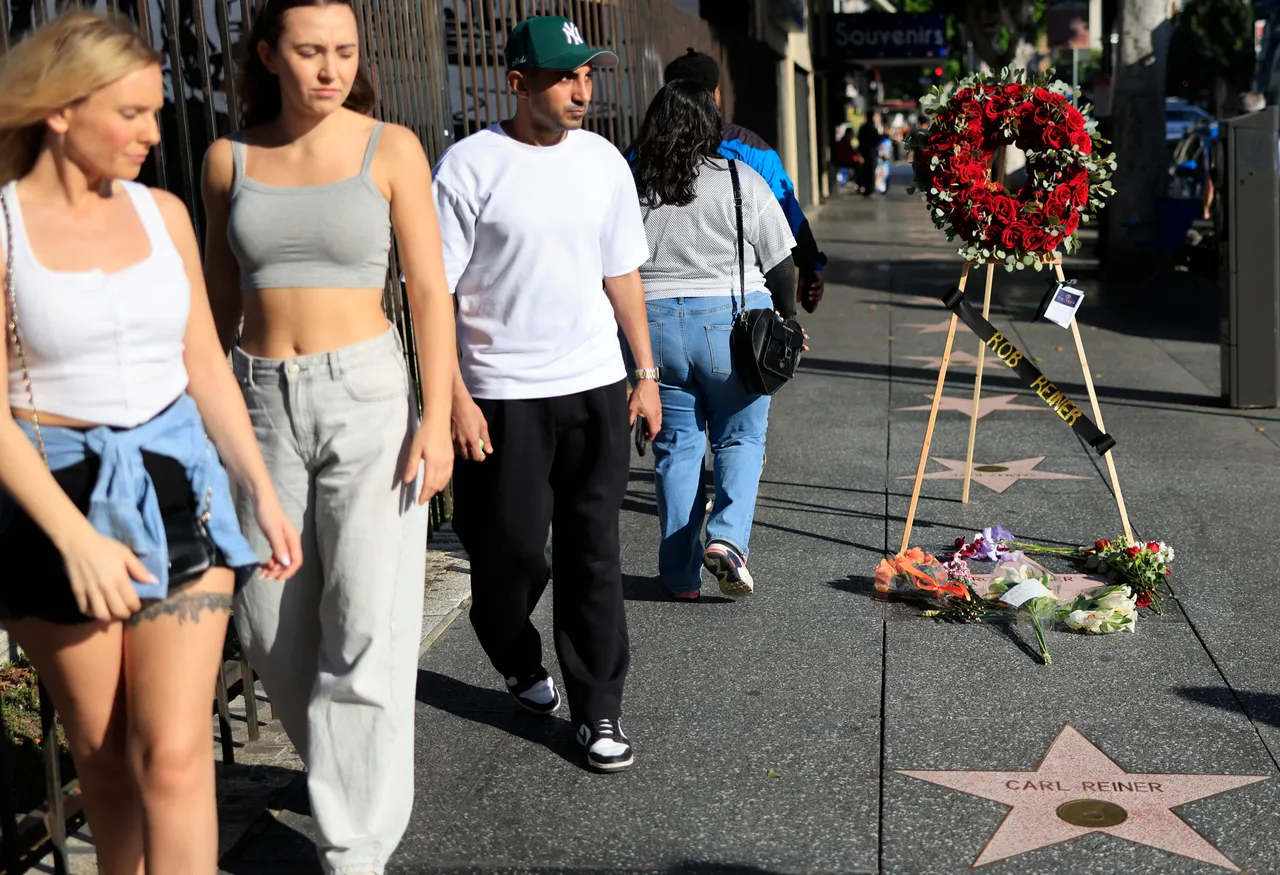 LOS ANGELES, CALIFORNIA - DECEMBER 15: People walk past the stars of director Rob Reiner and his father Carl Reiner on the Hollywood Walk of Fame on December 15, 2025 in Los Angeles, California. The LAPD confirmed that Rob Reiner and his wife Michele Singer Reiner were found dead in their Brentwood home. Their son Nick has been arrested in connection to their deaths. (Photo by Mario Tama/Getty Images)