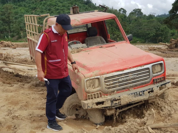 The executive director of Caritas Indonesia, Father Fredy Rante Taruk, visits a disaster site following flash floods and landslides in Indonesia on Dec. 23, 2025. Credit: Caritas Indonesia