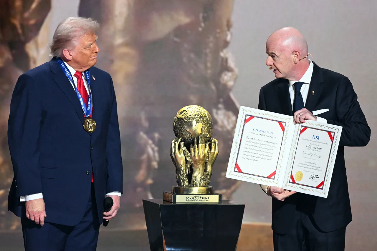 (L-R) US President Donald Trump receives the FIFA Peace Prize from Italian Fifa President Gianni Infantino during the draw for the 2026 FIFA Football World Cup taking place in the US, Canada and Mexico, at the Kennedy Center, in Washington, DC, on December 5, 2025. (Photo by Jim WATSON / AFP via Getty Images)