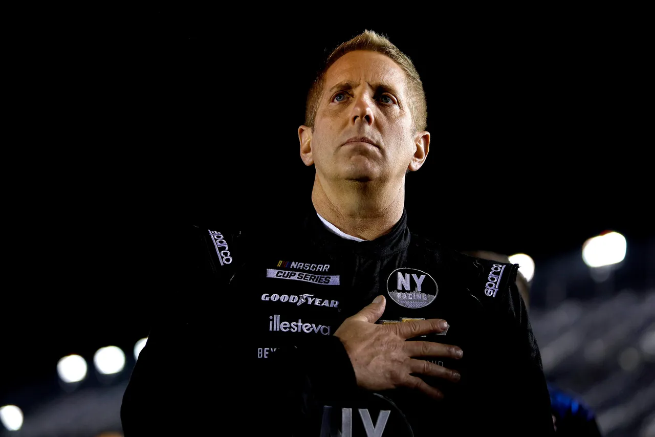 DAYTONA BEACH, FLORIDA - FEBRUARY 16: Greg Biffle, driver of the #44 Grambling State University Chevrolet, stands on the grid during qualifying for the NASCAR Cup Series 64th Annual Daytona 500 at Daytona International Speedway on February 16, 2022 in Daytona Beach, Florida. (Photo by Sean Gardner/Getty Images)