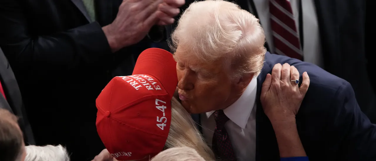 WASHINGTON, DC - MARCH 04: U.S. President Donald Trump kisses Rep. Marjorie Taylor Greene (R-GA) after addressing a joint session of Congress at the U.S. Capitol on March 04, 2025 in Washington, DC. President Trump was expected to address Congress on his early achievements of his presidency and his upcoming legislative agenda. (Photo by Andrew Harnik/Getty Images)