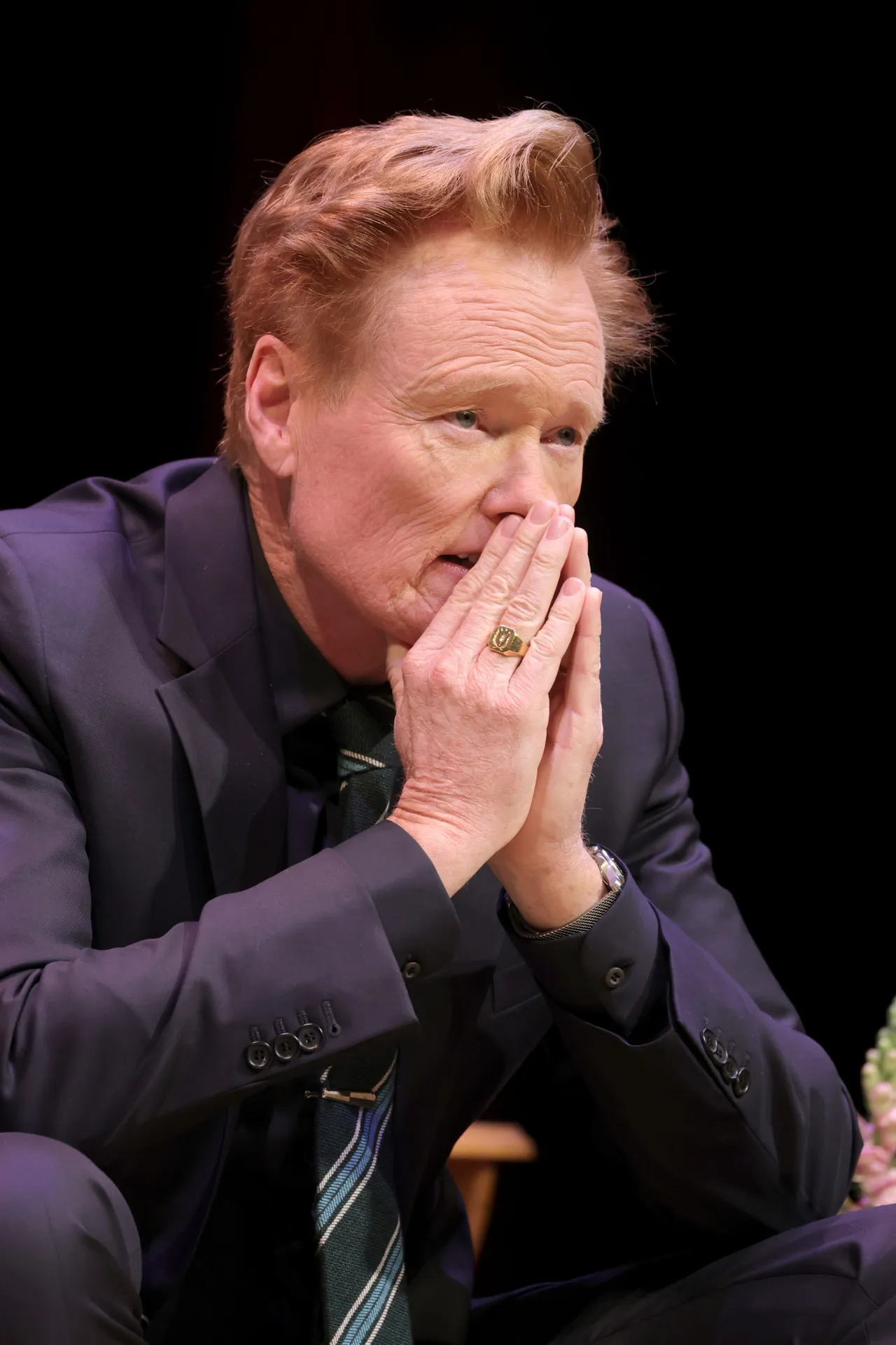 NEWARK, NEW JERSEY - DECEMBER 07: Conan O'Brien takes part in a conversation with Stephen Colbert to benefit Montclair Film at New Jersey Performing Arts Center on December 07, 2025 in Newark, New Jersey. (Photo by Michael Loccisano/Getty Images)