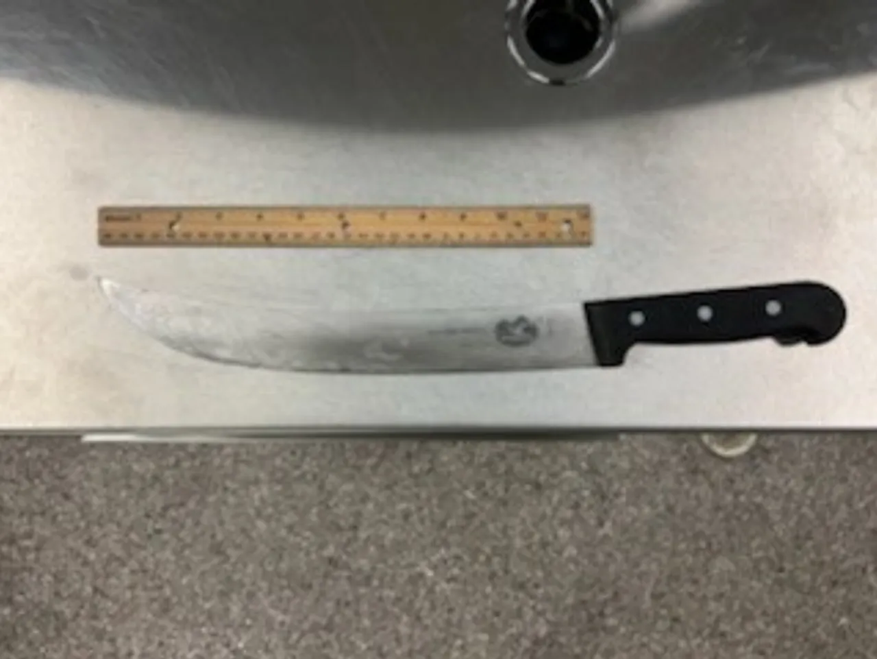 Court records show the butcher knife that anti-deportation rioter Julie Winters brandished and threw during a June protest in Portland, Oregon. (Image courtesy of the Department of Justice)