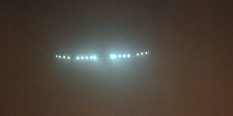 Triangular UFO Flies Over City In Eerie Video