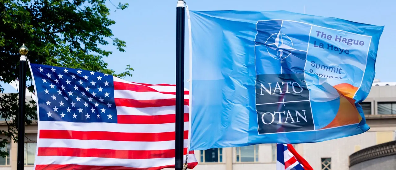 A US and a NATO flag flutter in the wind ahead of a NATO summit in The Hague, on June 23, 2025. Netherlands hosts a NATO summit on June 24 and 25, 2025.