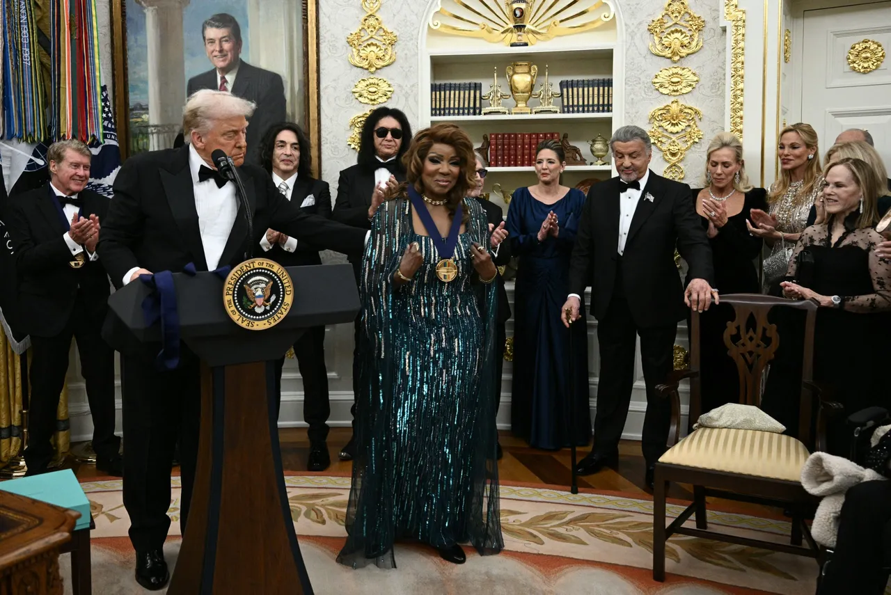 Kennedy Centre Honours recipient singer Gloria Gaynor receives a medal from US President Donald Trump during the Kennedy Centre Honours medal presentation ahead of tomorrow's ceremony, in the Oval Office of the White House in Washington, DC, December 6, 2025. (Photo by Brendan SMIALOWSKI / AFP via Getty Images)