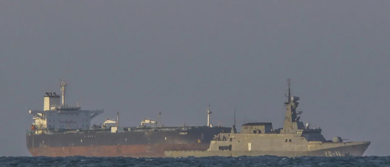 A Venezuelan navy patrol boat escorts Panamanian flagged crude oil tanker Yoselin near the El Palito refinery in Puerto Cabello, Venezuela on November 11, 2025.