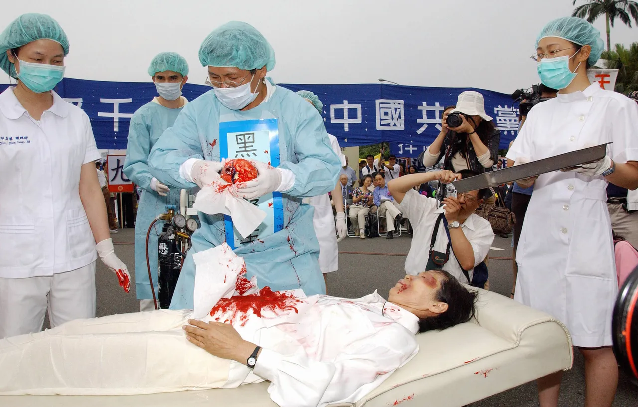 Taipei, TAIWAN: During a rally joined by thousands of Falun Gong practitiioners at Taipei 23 April 2006, four demonstrators play in an action drama against what they said was the Chinese communists' killing of Falun Gong followers and harvesting of their organs in concentration camps.(Photo credit PATRICK LIN/AFP via Getty Images)