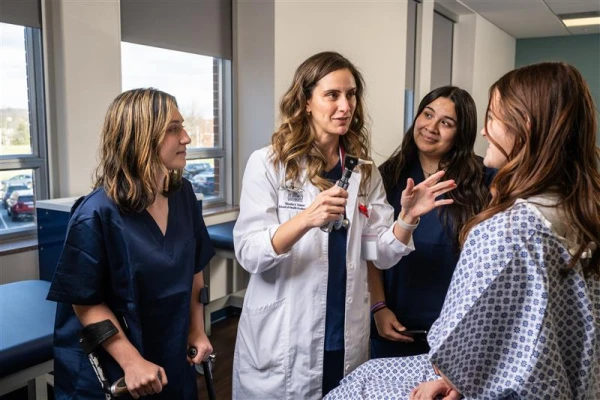Associate Program Director Leanne Hedges, MMS, PA-C, demonstrates a comprehensive physical examination as part of clinical training for PA students. Credit: Photo courtesy of Mount St. Mary's University