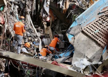 Filipino rescuers detect 'signs of life' in garbage avalanche that left dozens missing and killed 4