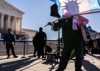 Women's sports activists celebrate after Supreme Court oral arguments