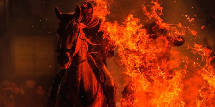 Horses leap through flames and pets go to church in Spanish rituals honoring St. Anthony