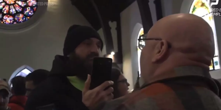 Justice Dept. investigating after activists disrupt Minnesota church where ICE official is a pastor