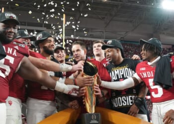 Indiana completes undefeated season and wins first national title, beating Miami 27-21 in CFP final