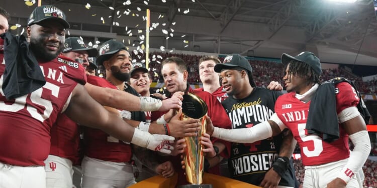 Indiana completes undefeated season and wins first national title, beating Miami 27-21 in CFP final