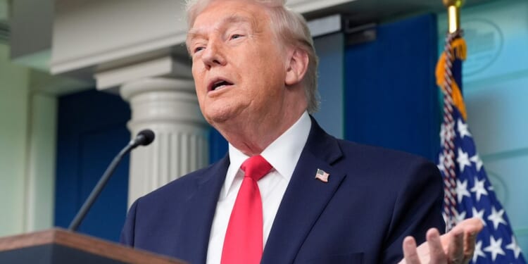 Trump boasts about his year-one record in surprise visit to White House briefing