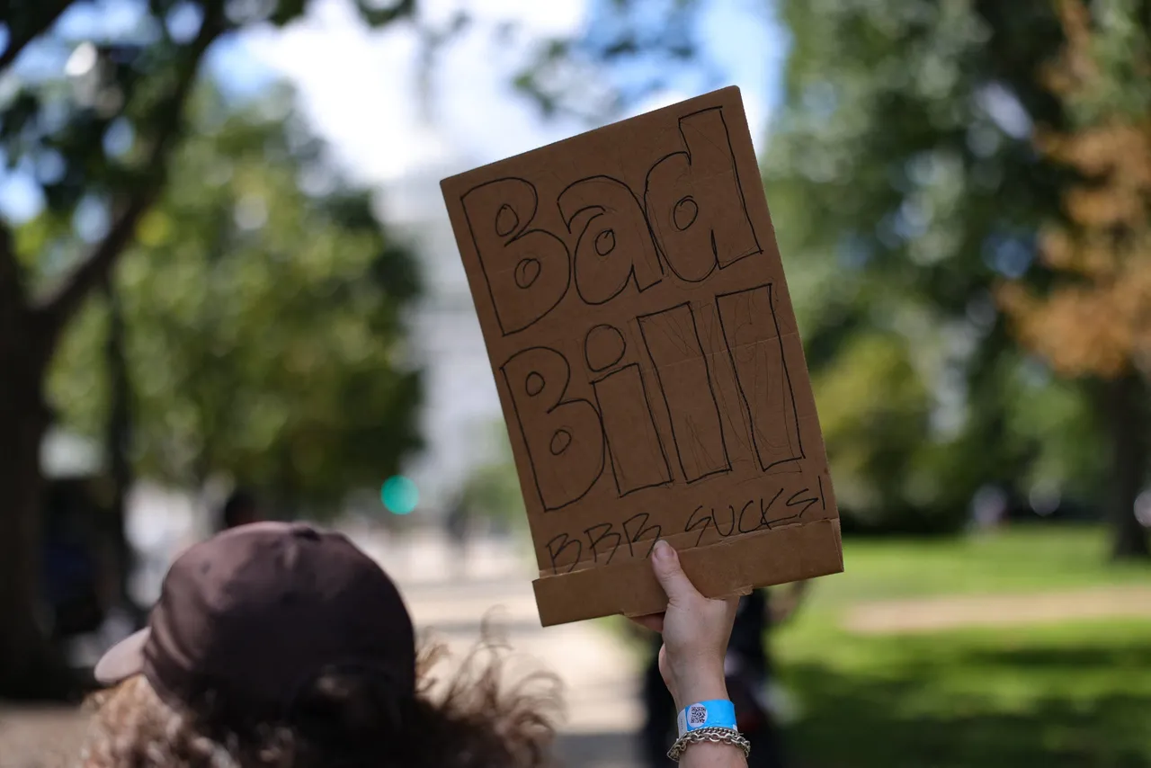 A demonstrator holds a sign during an anti-Trump march to the U.S. Capitol in Washington, D.C. on September 2, 2025.