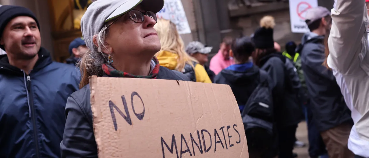 CHICAGO, ILLINOIS - OCTOBER 25: Chicago police officers along with other city workers and their supporters protest at city hall the mayor's vaccination policy for city employees on October 25, 2021 in Chicago, Illinois. The city has started to place police officers on unpaid leave for refusing to comply with the city's requirements that they report their COVID-19 vaccination status. As of last week, only about 65 percent of the city's police have complied with the order. (Photo by Scott Olson/Getty Images)