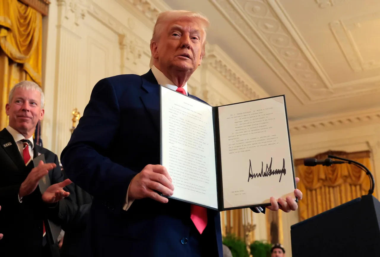 U.S. President Donald Trump holds an executive orders after signing a series of orders on American energy production during a ceremony in the East Room of the White House on April 08, 2025 in Washington, DC. (Photo by Anna Moneymaker/Getty Images)