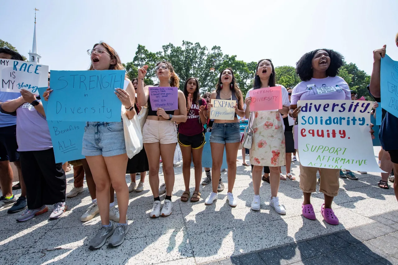 Proponents of affirmative action hold signs during a protest at Harvard University in Cambridge, Massachusetts, on July 1, 2023.