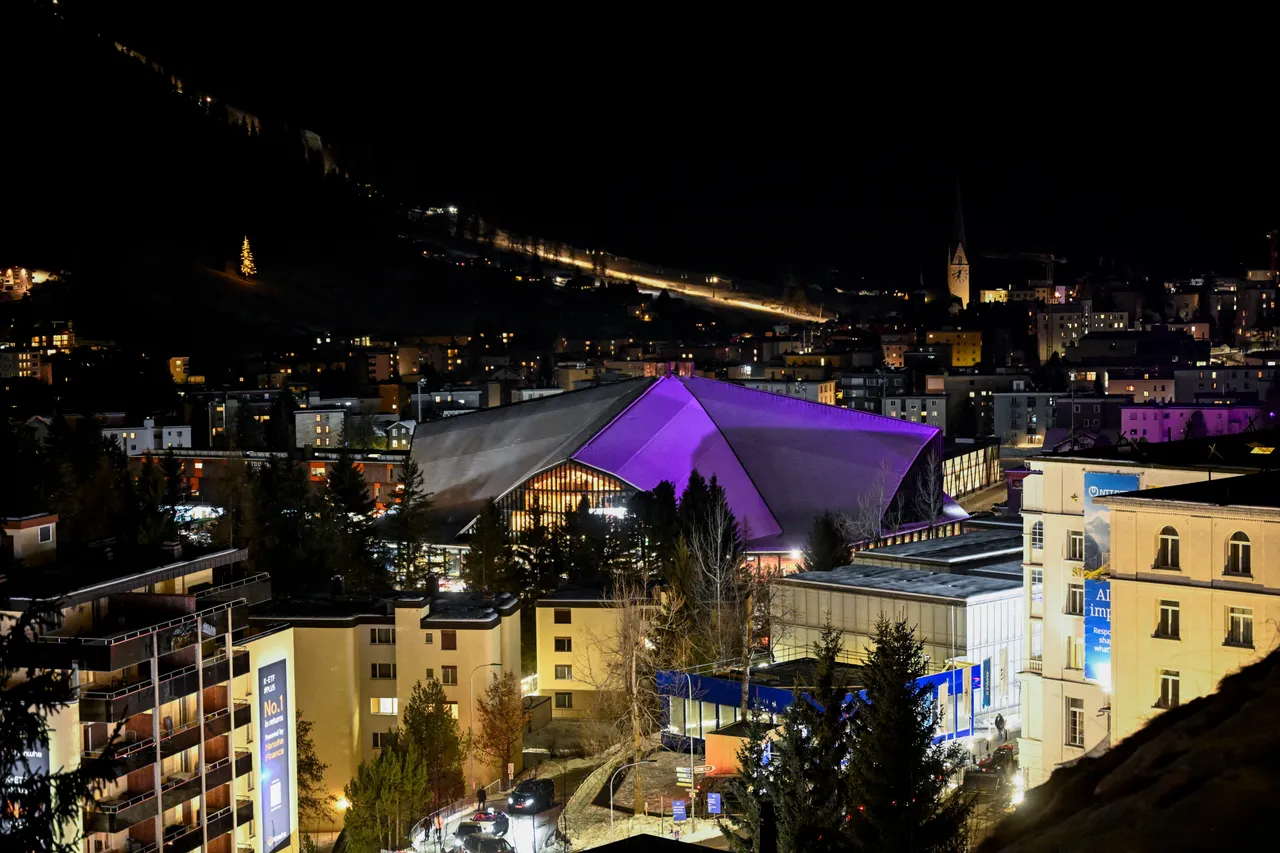 TOPSHOT - This photograph taken on January 19, 2026, shows a general view of the Congress Centre that hosts the World Economic Forum (WEF) annual meeting and the Alpine resort of Davos by night. The World Economic Forum takes place in Davos from January 19 to January 23, 2026. (Photo by INA FASSBENDER / AFP via Getty Images)