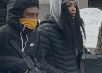 Man Seen Carrying What Appears To Be High-Powered Firearm In Minneapolis Amid Violent ICE Protests