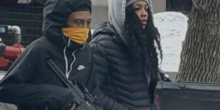 Man Seen Carrying What Appears To Be High-Powered Firearm In Minneapolis Amid Violent ICE Protests