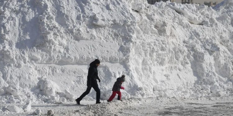 Russia’s Kamchatka Peninsula Sees Building Entrances Blocked, Cars Buried After Biggest Snowstorm In 60 Years