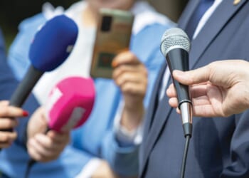'Squad' Member's Husband Slaps Phone Out of Reporter's Hand During Fraud Question [WATCH]
