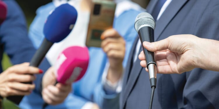'Squad' Member's Husband Slaps Phone Out of Reporter's Hand During Fraud Question [WATCH]