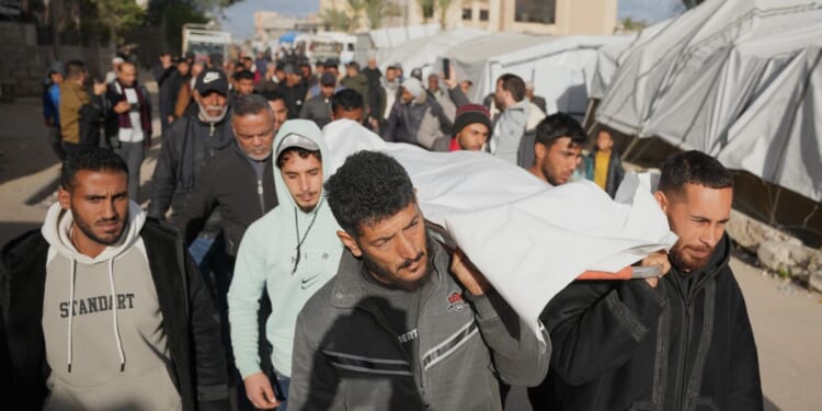 Israel strikes Gaza, killing 21 including women and children, after saying Hamas violated deal