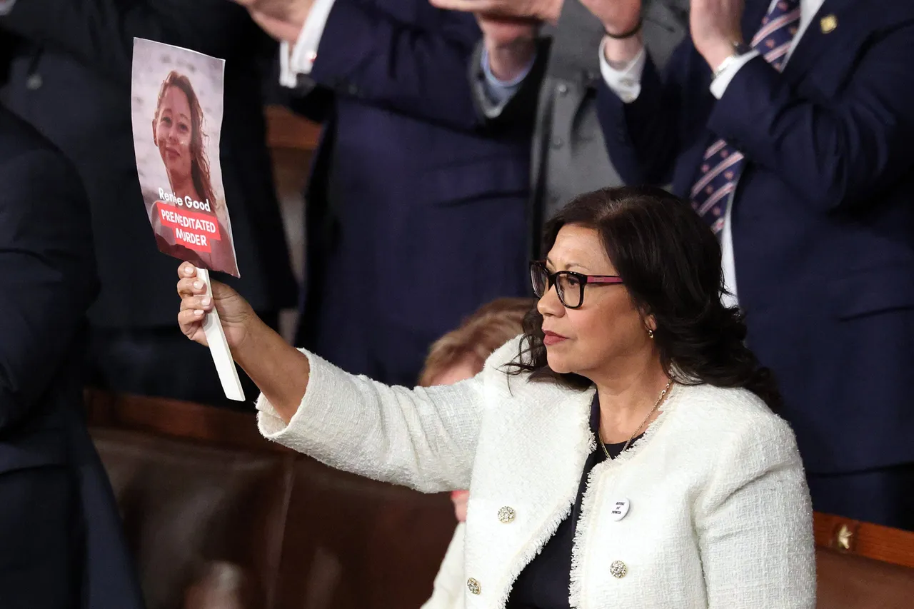 Rep. Norma Torres (D- CA) holds up a photo of Minnesota shooting victim Renee Good who was killed during an immigration enforcement operation during U.S. President Donald Trump's State of the Union address during a Joint Session of Congress at the U.S. Capitol on February 24, 2026, in Washington, DC. Trump delivered his address days after the Supreme Court struck down the administration's tariff strategy and amid a U.S. military buildup in the Persian Gulf threatening Iran. (Photo by Win McNamee/Getty Images)