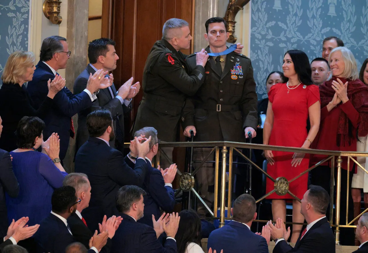 Chief Warrant Officer Eric Slover receives the Congressional Medal of Honor during U.S. President Donald Trump's State of the Union address during a Joint Session of Congress at the U.S. Capitol on February 24, 2026, in Washington, DC. Trump delivered his address days after the Supreme Court struck down the administration's tariff strategy and amid a U.S. military buildup in the Persian Gulf threatening Iran. (Photo by Chip Somodevilla/Getty Images)