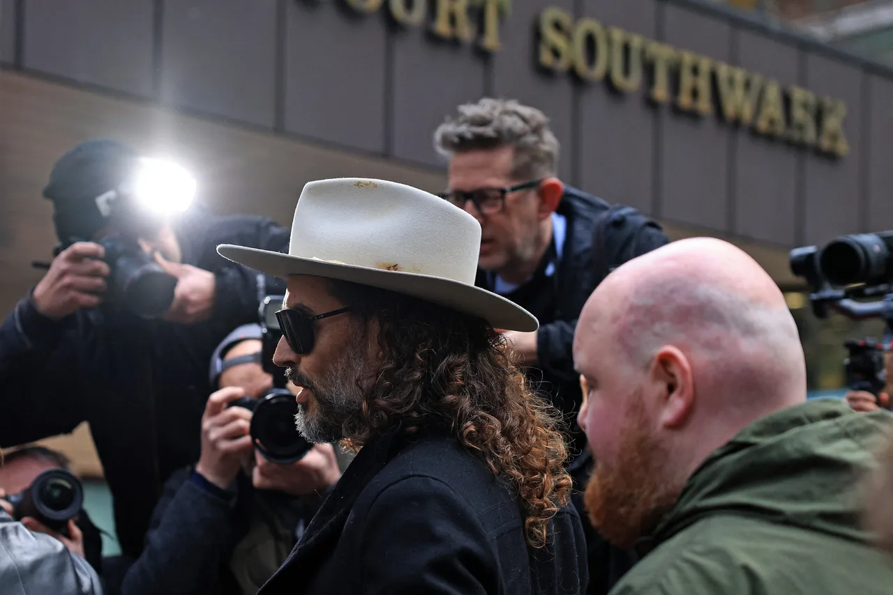 British comedian and actor Russell Brand arrives to attend a one-day plea and trial preparation hearing at Southwark Crown Court in south London on February 24, 2026. (Photo by Adrian DENNIS / AFP via Getty Images)
