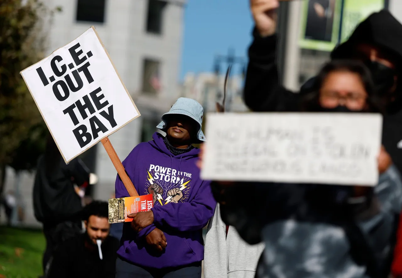 SAN FRANCISCO, CALIFORNIA - OCTOBER 23: Protesters hold signs during an anti-ICE protest outside of San Francisco City Hall on October 23, 2025 in San Francisco, California. San Francisco Mayor Daniel Lurie says he received a call from U.S. President Donald Trump on Wednesday evening to tell him that the anticipated surge of federal immigration agents in San Francisco has been called off. (Photo by Justin Sullivan/Getty Images)
