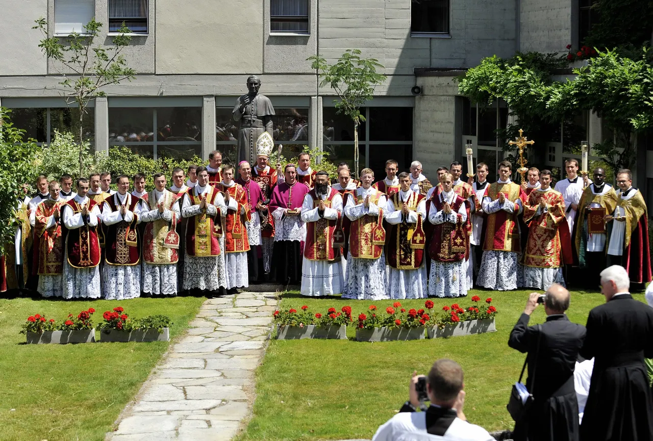 New priests and deacons pose for a picture after the ordination mass of the breakaway Traditionalist Catholic Roman Society of St Pius X in Econe, western Switzerland on June 29, 2009. (Photo credit FABRICE COFFRINI/AFP via Getty Images)