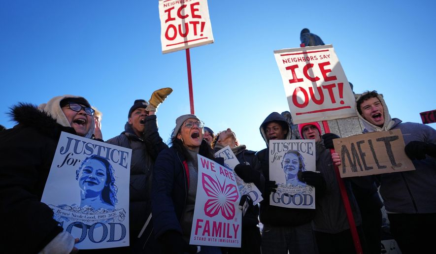 Protesters gather in front of the Minnesota State Capitol in response to the death of Renee Good, who was fatally shot by an ICE officer last week, Wednesday, Jan. 14, 2026, in St. Paul, Minn. (AP Photo/Abbie Parr)