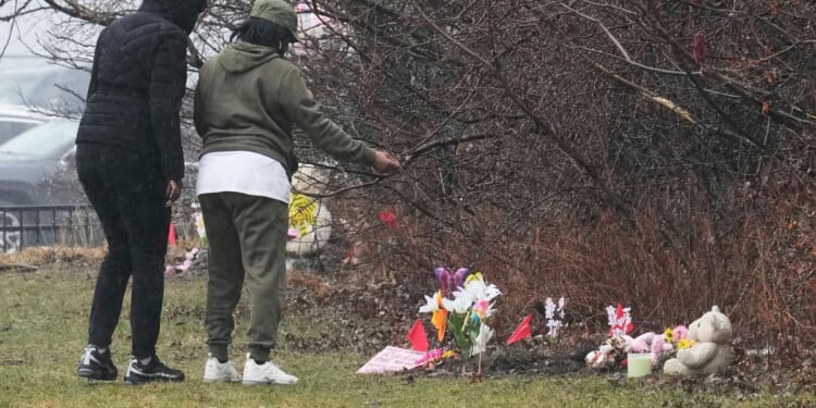 Mother of 2 girls found in shallow graves in Cleveland charged with murder