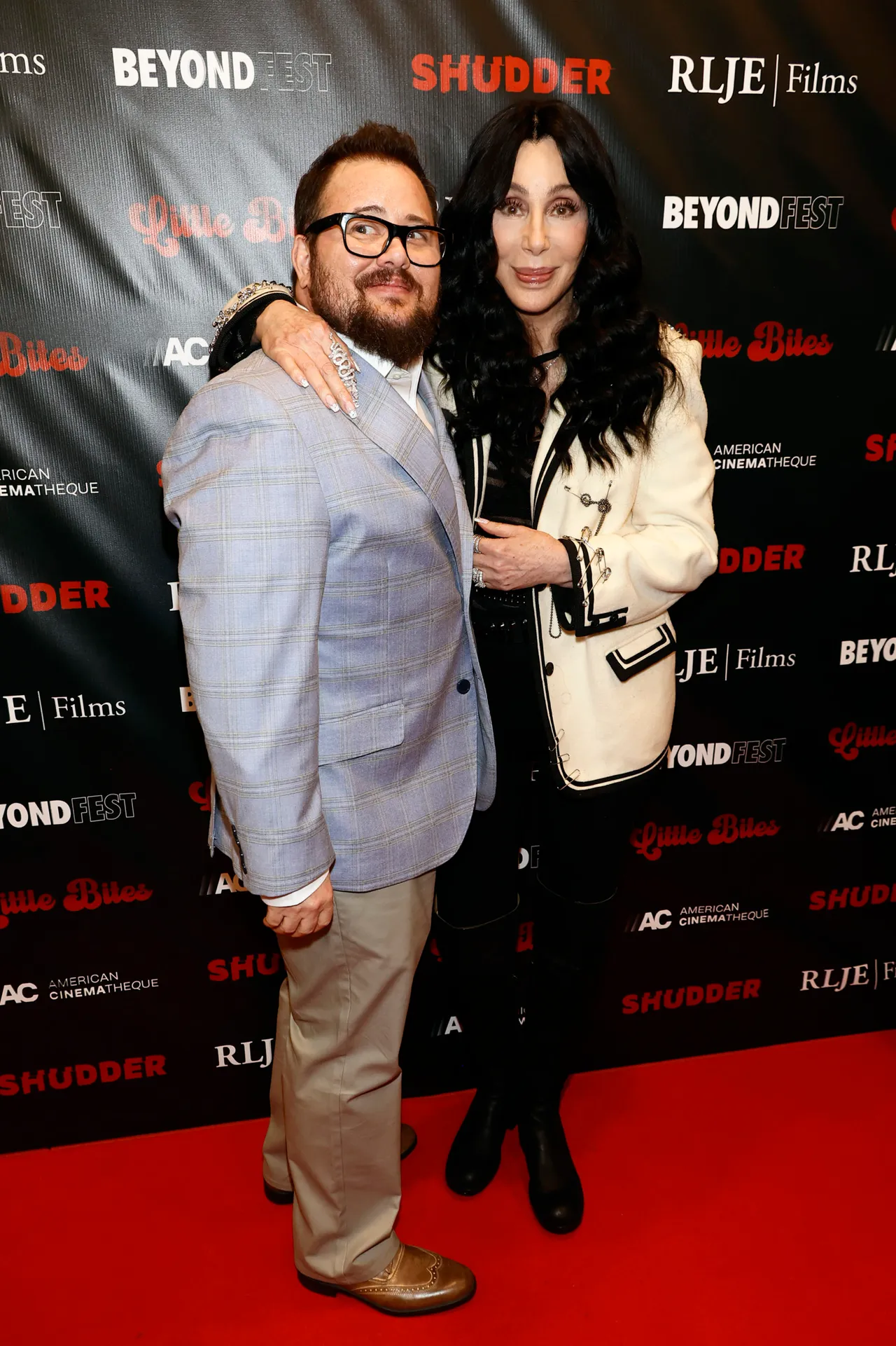 SANTA MONICA, CALIFORNIA - OCTOBER 03: (L-R) Chaz Bono and Cher attend the Los Angeles Premiere of 