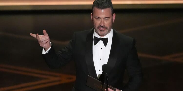 At Oscars, Kimmel zings Melania Trump, compares Colbert to victim of totalitarian regime