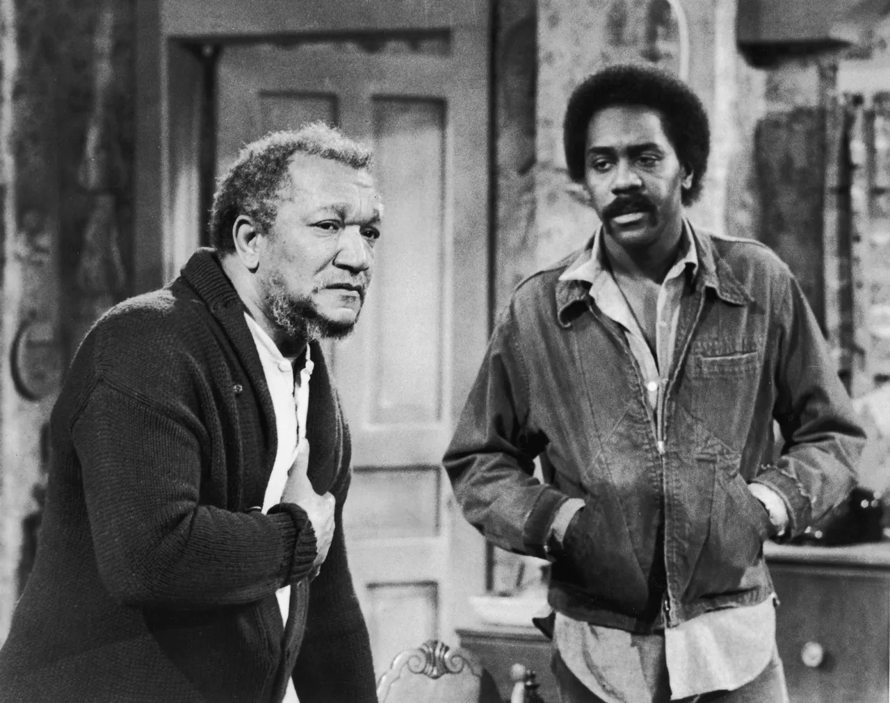 American actors Red Foxx (1922 - 1991) (left) Demond Wilson in a still from the television series, 'Sanford And Son,' c. 1974. (Photo by NBC Television/Courtesy of Getty Images)