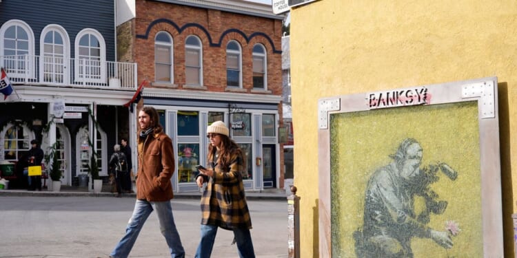 The media may have unmasked Banksy — again. That’s angered some art fans but not ruffled dealers