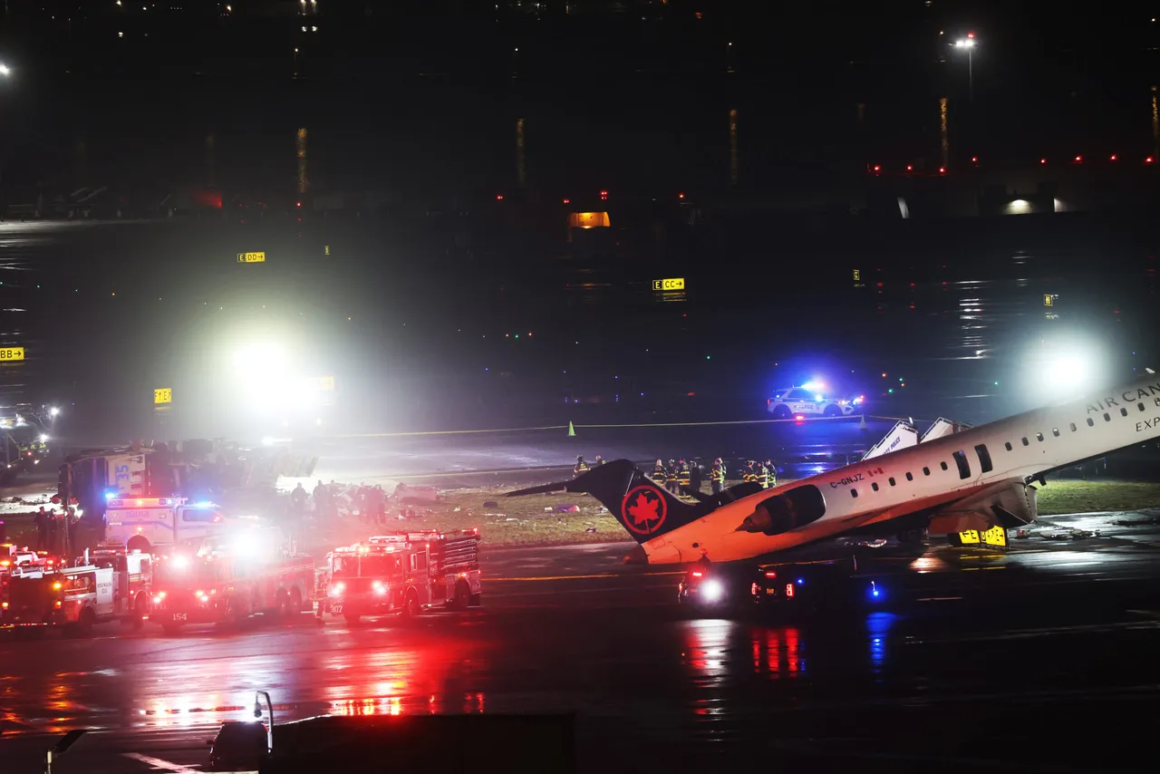 NEW YORK, NEW YORK - MARCH 23: An Air Canada Express plane sits on the tarmac after it collided with a fire truck on the tarmac at LaGuardia Airport on March 23, 2026 in New York City. The plane had landed from a flight from Montreal. (Photo by Spencer Platt/Getty Images)