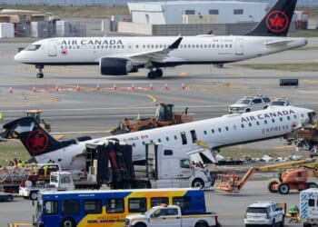 Mangled plane in LaGuardia crash is towed from runway as most injured passengers leave hospital